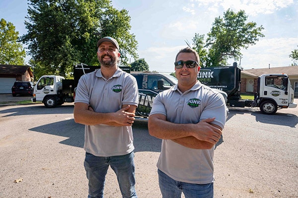 Junk Free LLC team members folding arms