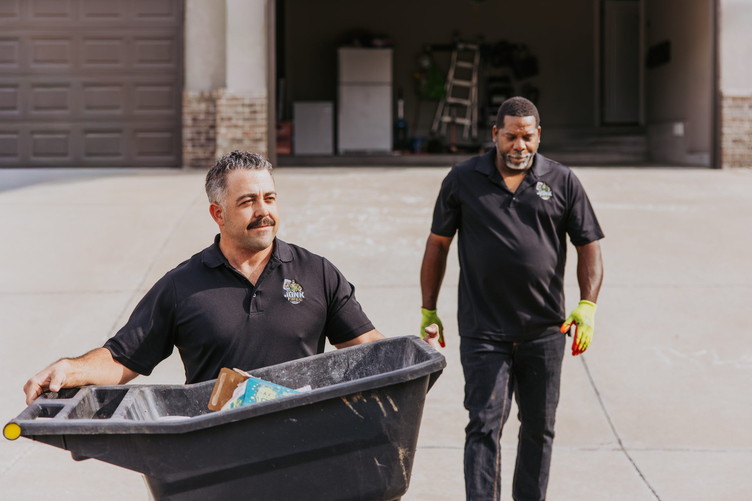 Junk Free crew removing household items from a residential garage