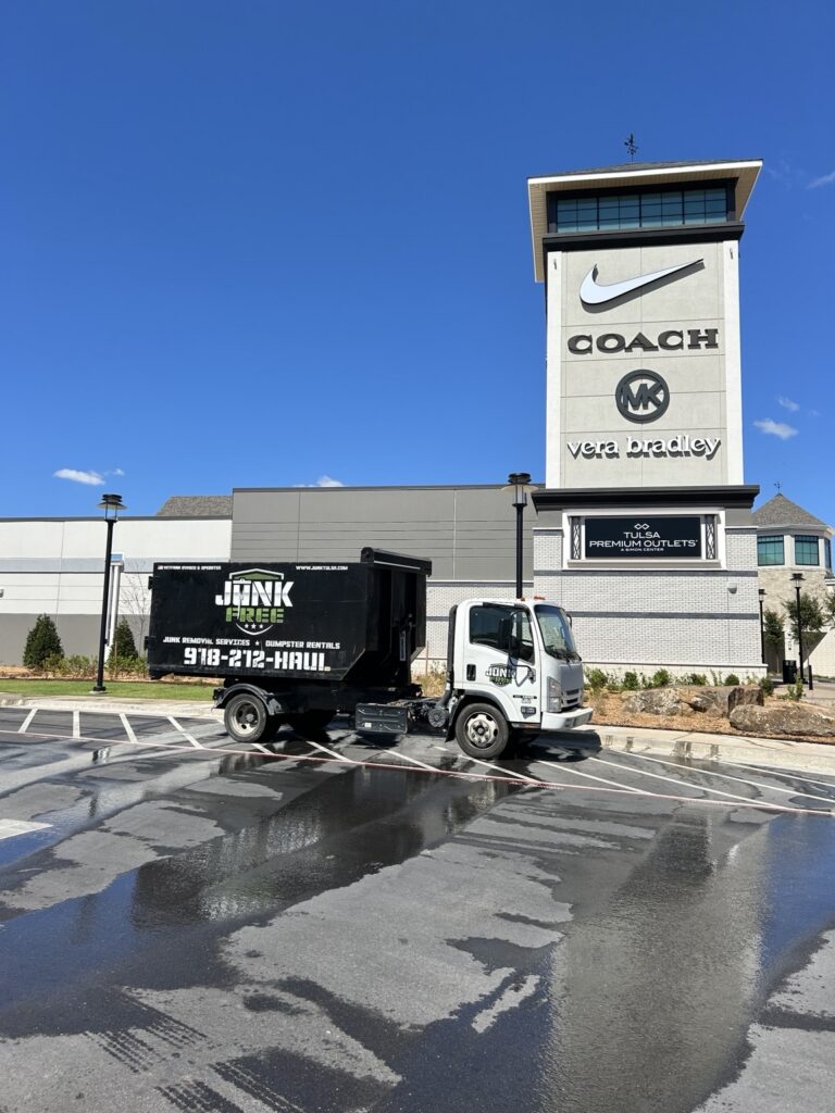 Junk Free truck carrying a 20-yard dumpster at Tulsa Premium Outlets in Jenks