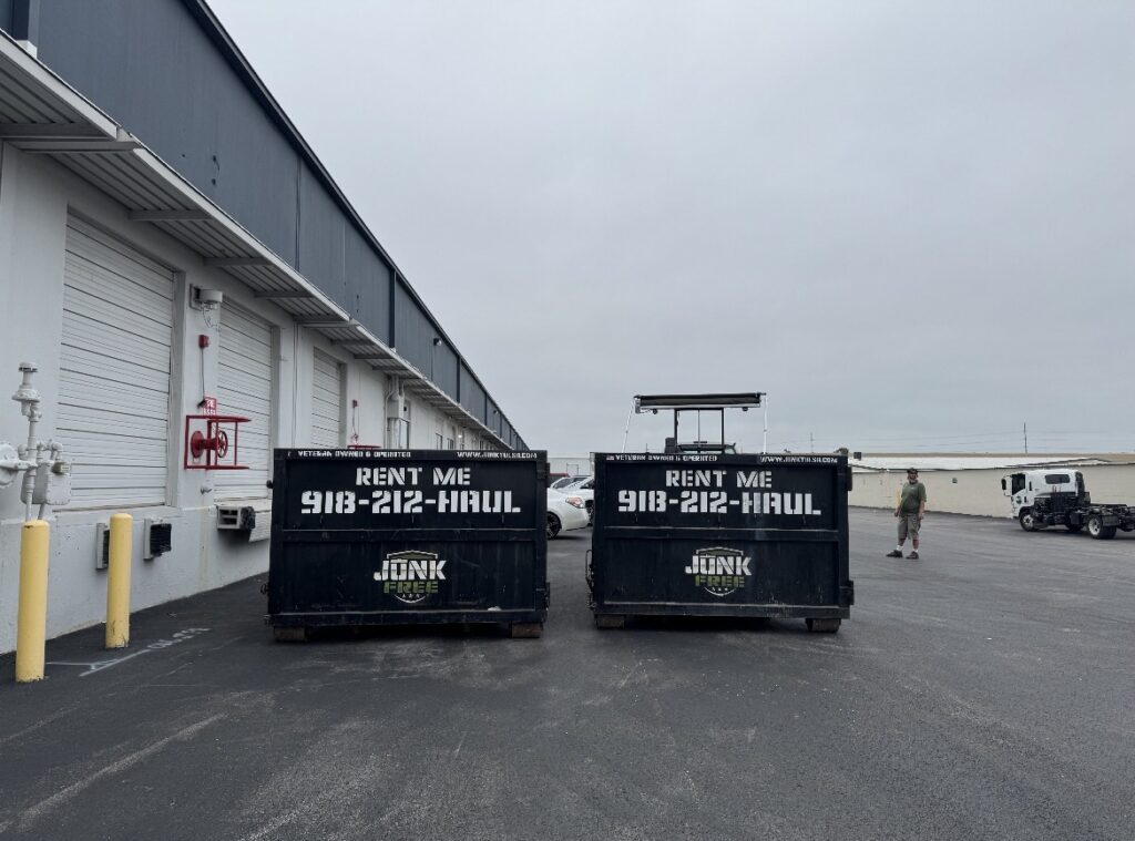 Two Junk Free 15-yard dumpsters outside a commercial building