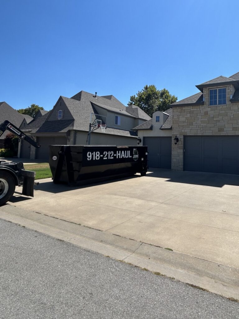 Junk Free 20-yard roll-off dumpster in a residential driveway